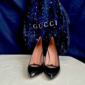Gucci black patterned leather shoes.